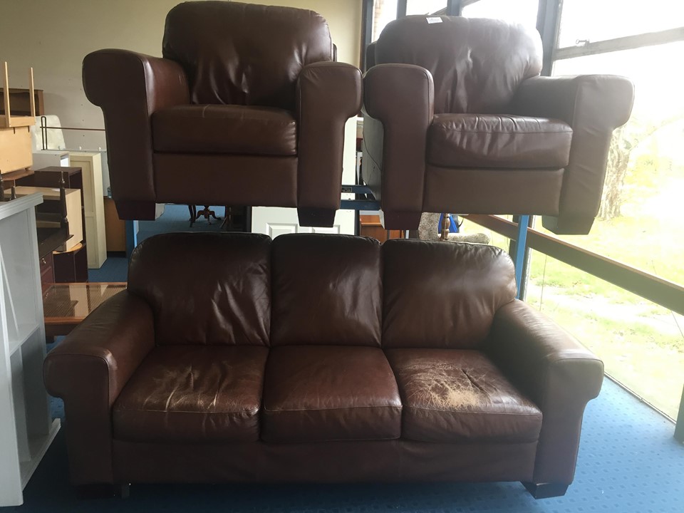 Brown real leather 3 piece suite. 3 seater sofa & 2 chairs. Very comfy but one end of the sofa has had the most use (see photos). Could be revived with some good leather food & stain.